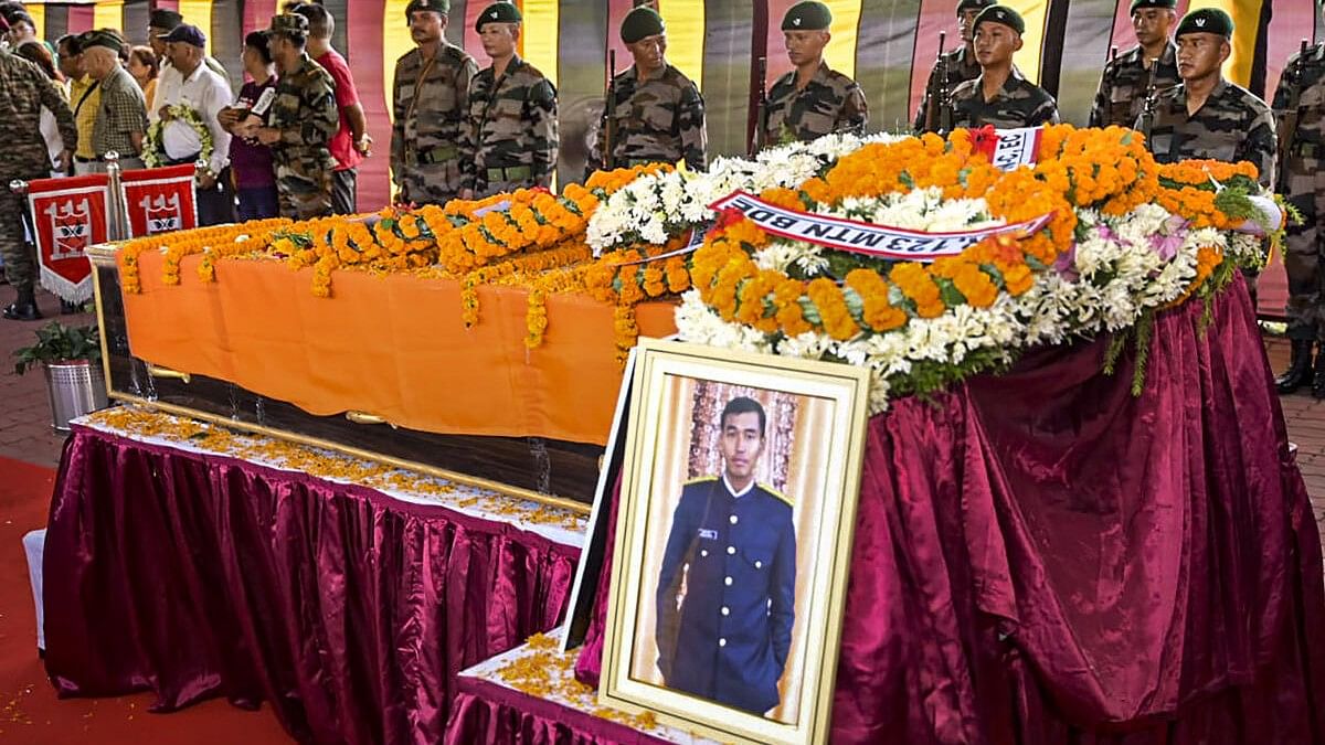 <div class="paragraphs"><p>A portrait of martyred Army captain Brijesh Thapa who was killed in a terrorist encounter in Jammu and Kashmir's Doda district, kept near his mortal remains.</p></div>