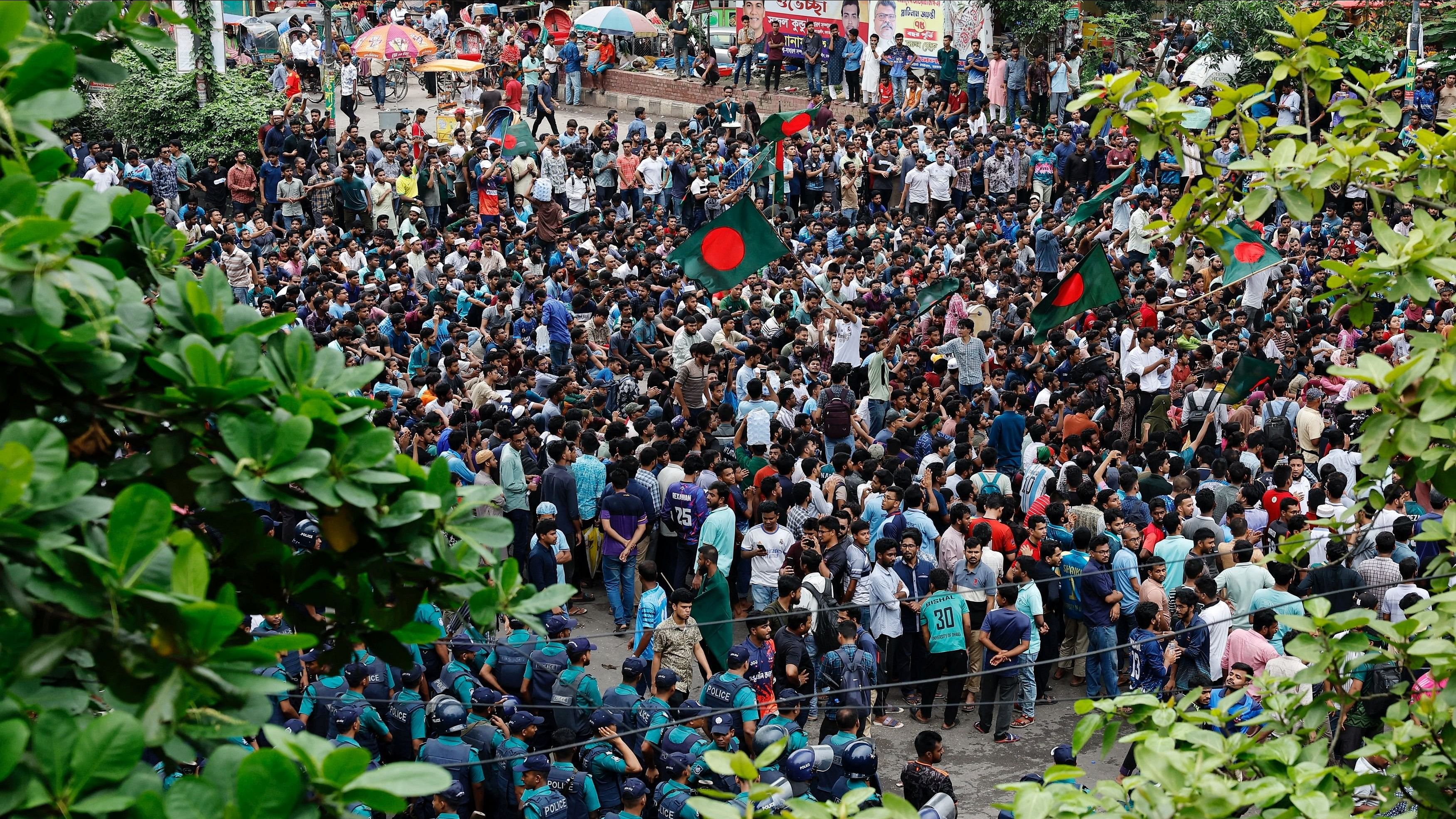 <div class="paragraphs"><p>Students and job seekers block a road as they protest to ban quotas for government job at Shahbagh Square in Dhaka, Bangladesh, July 3, 2024. </p></div>