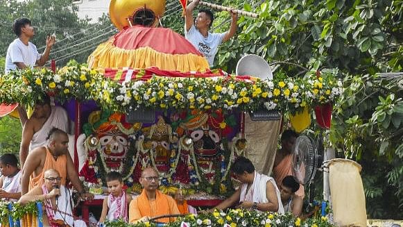 <div class="paragraphs"><p>Guwahati: Devotees pull a chariot carrying the idols of Lord Jagannath, Lord Balabhadra and Goddess Subhadra during the annual ‘Rath Yatra, in Guwahati, Sunday, July 7, 2024. </p></div>