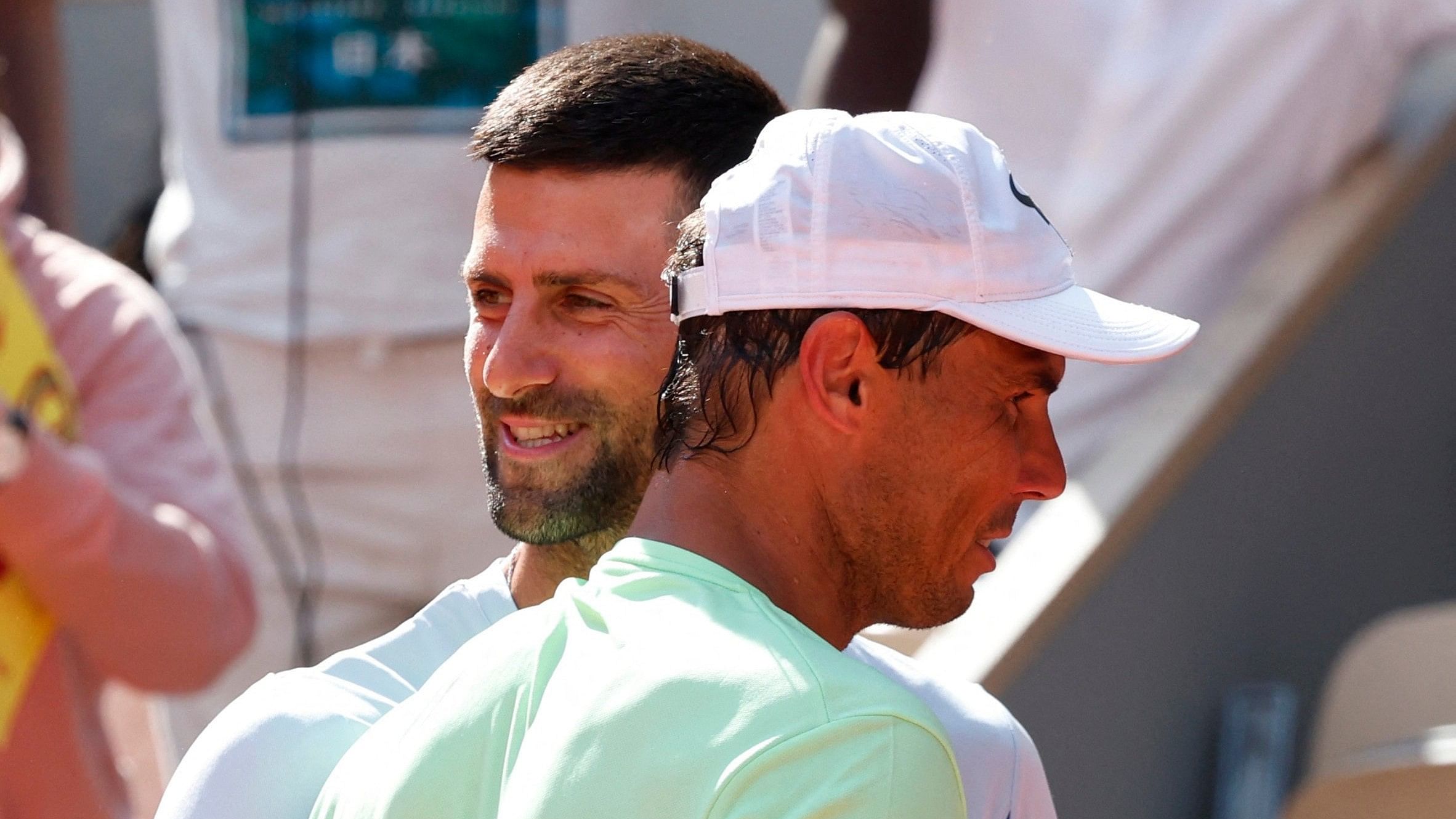 <div class="paragraphs"><p>Serbia's Novak Djokovic hugs Spain's Rafael Nadal.</p></div>