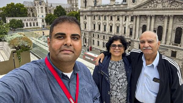 <div class="paragraphs"><p>Navendu Mishra (L), a Labour Party candidate who has been elected to the House of Commons for a second consecutive term from the Stockport constituency, with others.</p></div>