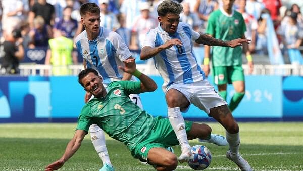 <div class="paragraphs"><p>Men's Group B's Argentina vs Iraq match sees Cristian Medina of Argentina in action with Hussein Ali of Iraq.</p></div>