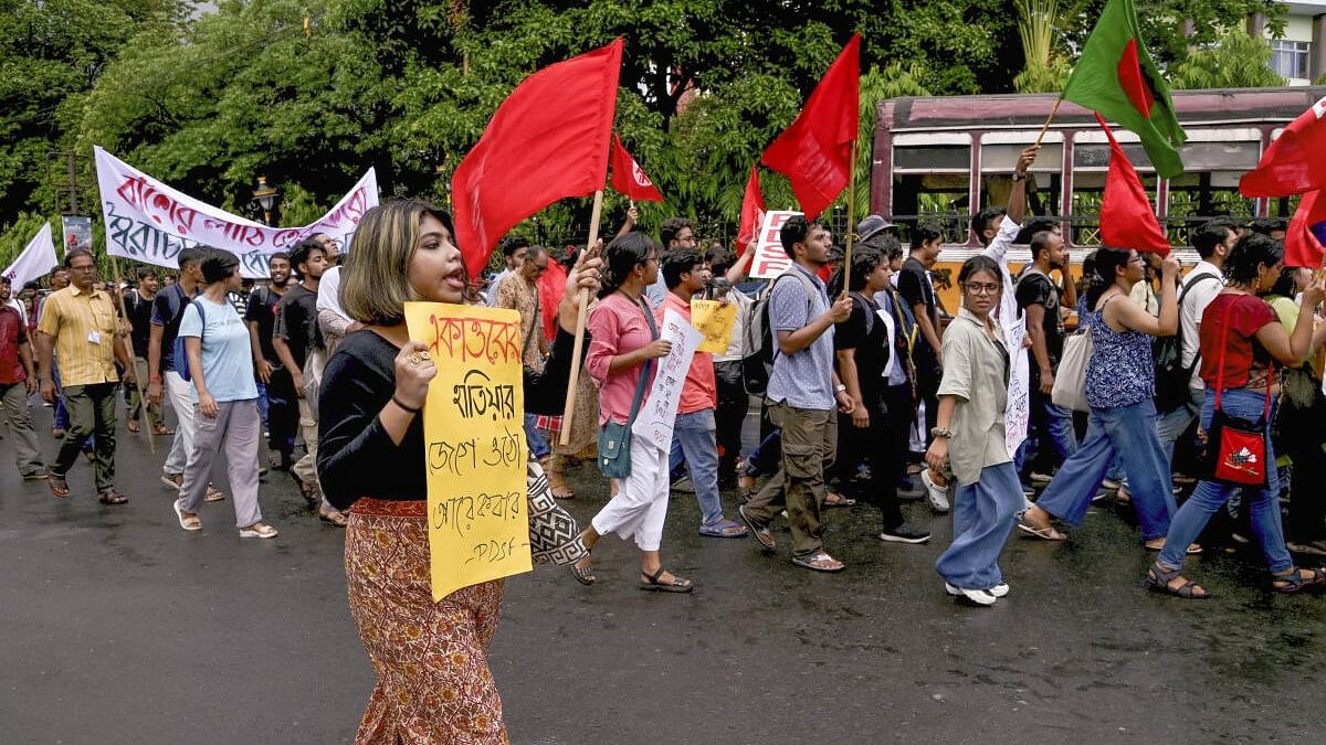 <div class="paragraphs"><p>Activists of different left-aligned student unions and human rights organisations raise slogans during their protest march towards Bangladesh Deputy High Commission in solidarity with the ongoing stir in Bangladesh against quota system, in Kolkata.</p></div>