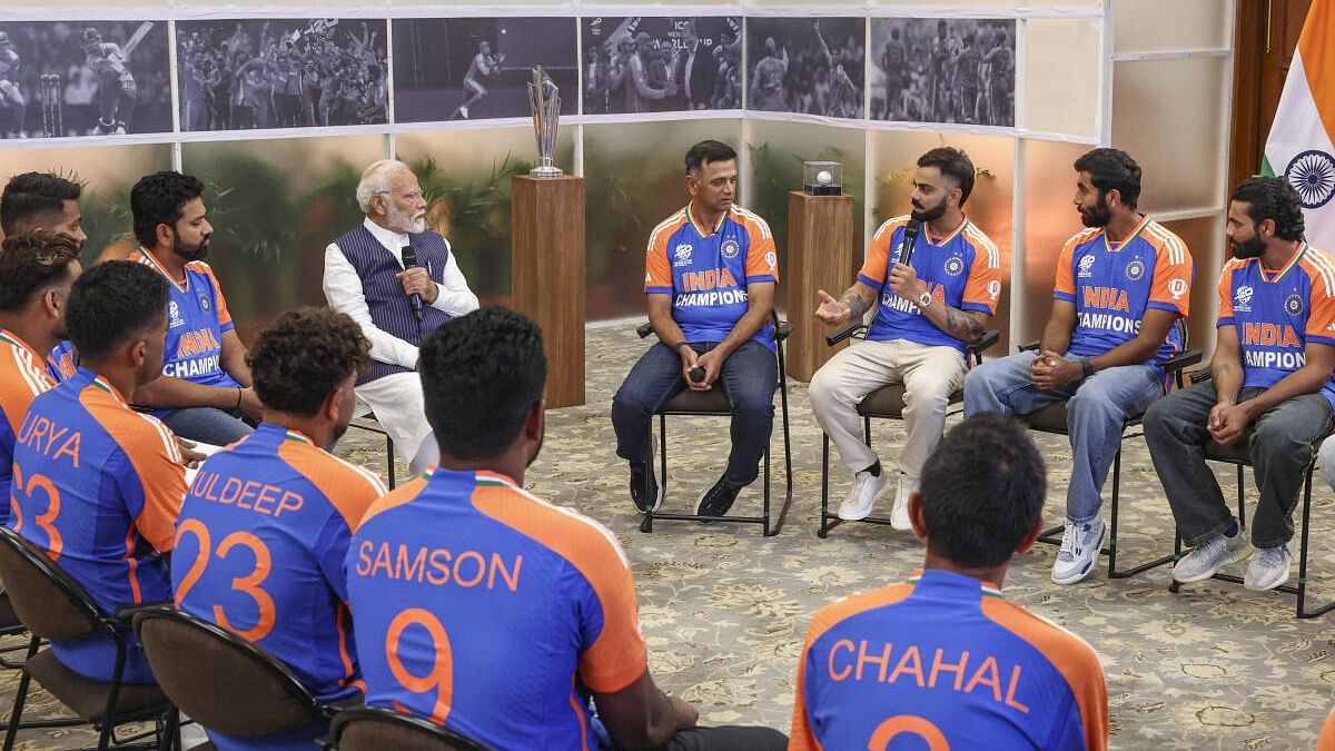 <div class="paragraphs"><p>Prime Minister Narendra Modi interacts with the T20 World Cup-winning Indian cricket team during a breakfast hosted by PM at 7, LKM, in New Delhi, Thursday, July 4, 2024.</p></div>