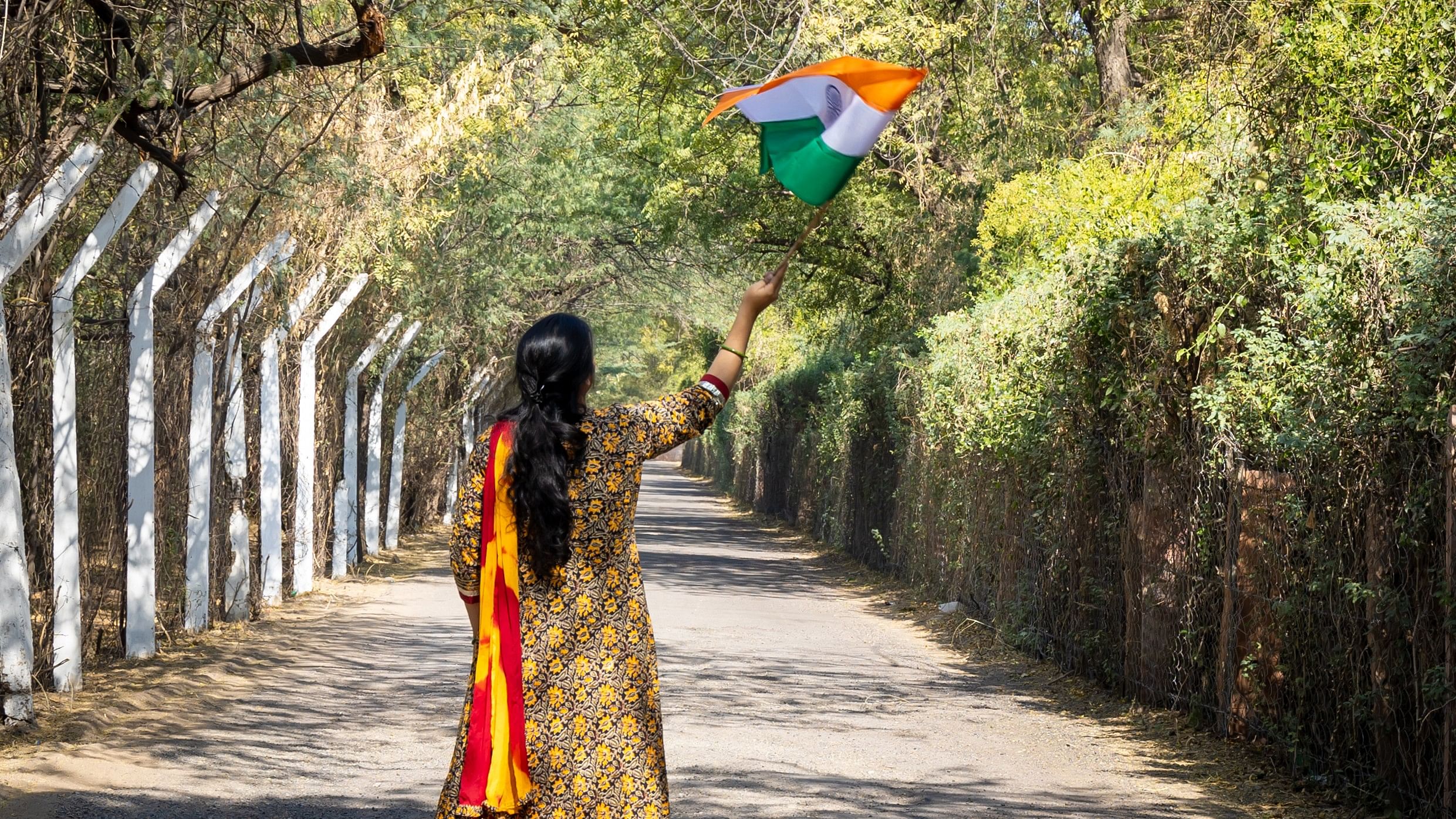 <div class="paragraphs"><p>A woman waves a Tricolour. Image for representation.</p></div>