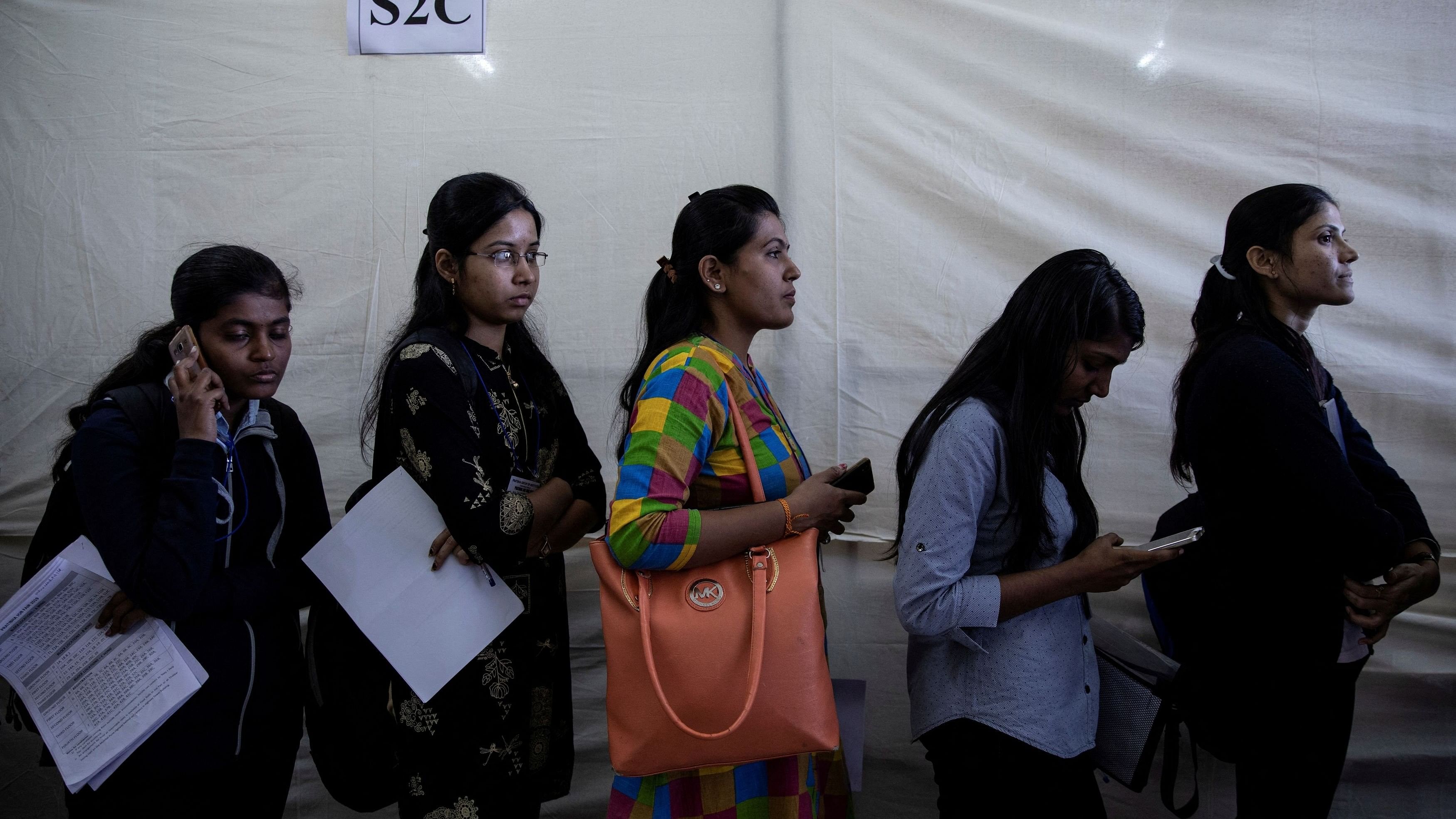 <div class="paragraphs"><p>Job seekers line up for interviews at a job fair in Chinchwad, India.</p></div>