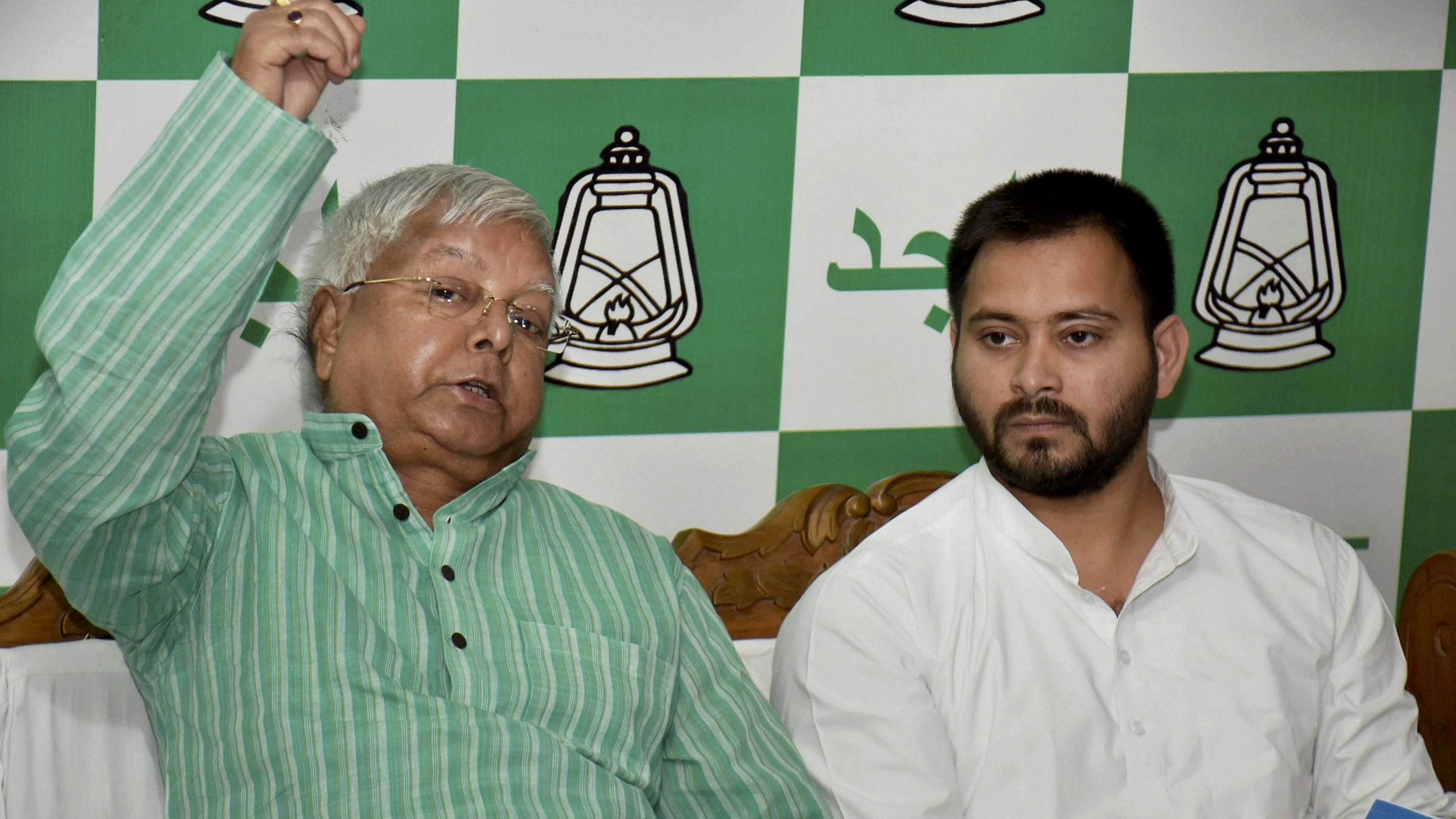 <div class="paragraphs"><p>RJD Chief Lalu Prasad  with former Bihar Deputy CM Tejashwi Yadav in Patna</p></div>