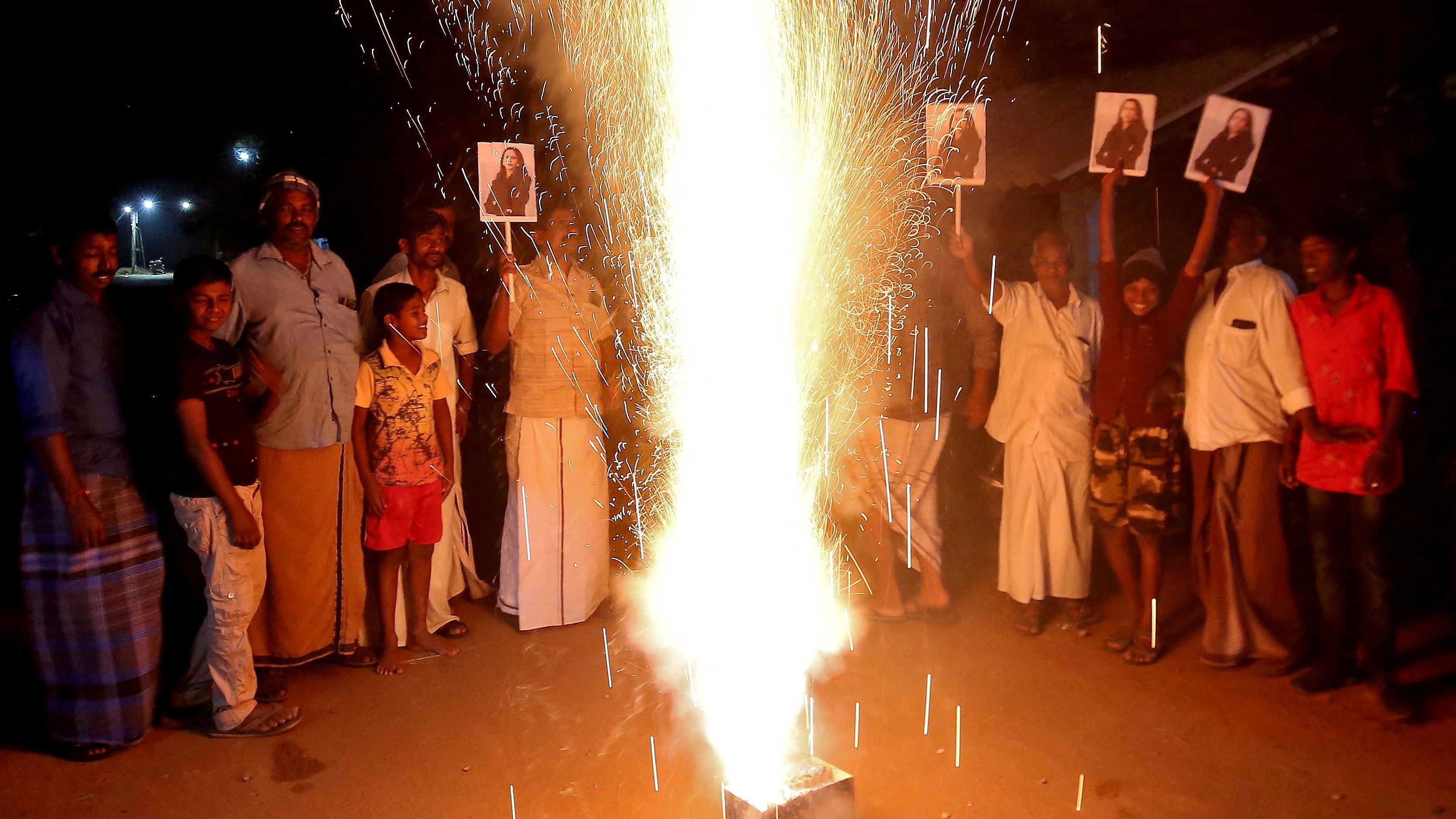 <div class="paragraphs"><p>People in Thulasendrapuram hold posters of Kamala Harris to celebrate after she was sworn in as US Vice President, Jan 20, 2021.</p></div>