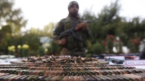 <div class="paragraphs"><p>An Indian army soldier stands behind a display of seized arms and ammunition at a garrison in Srinagar. Representative image.</p></div>