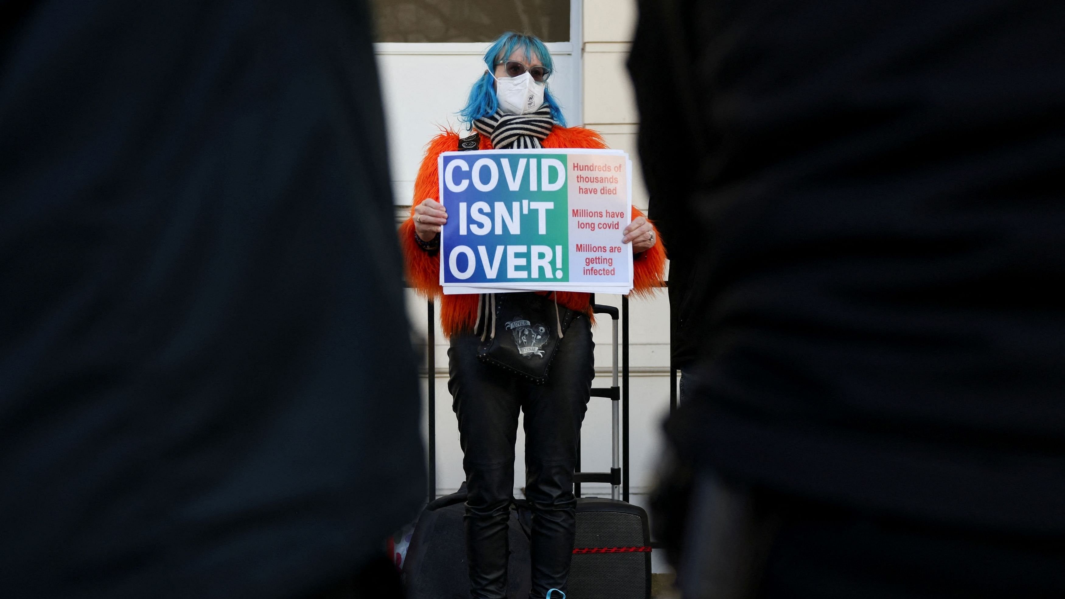 <div class="paragraphs"><p>A demonstrator holds a placard outside the UK COVID-19 inquiry, in London, Britain, December 11, 2023. </p></div>