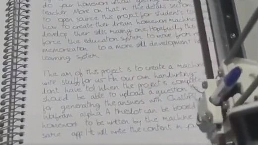 <div class="paragraphs"><p>A screengrab of the video showing the AI machine writing the homework.</p></div>