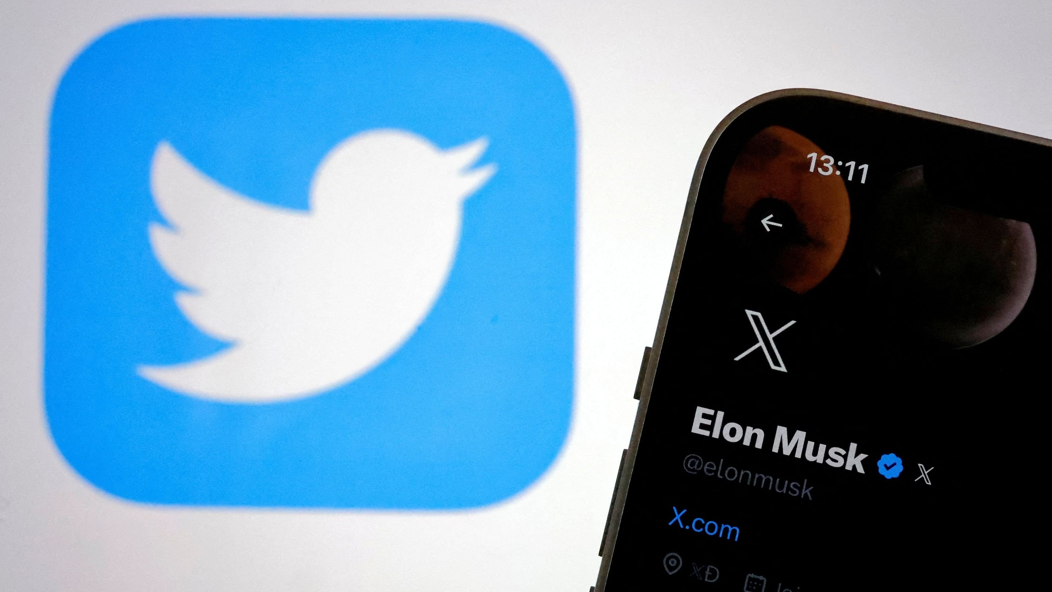 <div class="paragraphs"><p>The new logo of Twitter is seen on Elon Musk’s Twitter account on a phone as the old Twitter logo is displayed on a screen.</p></div>