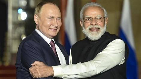 <div class="paragraphs"><p>PM Modi seen with Vladimir Putin</p></div>