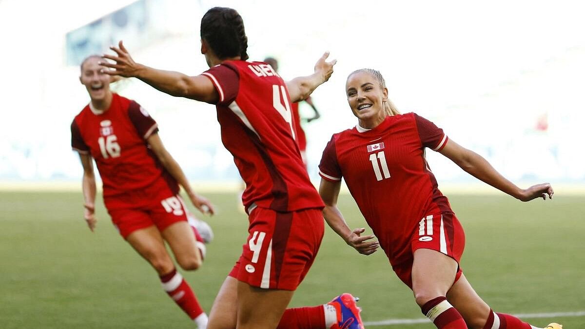 <div class="paragraphs"><p>Evelyne Viens of Canada celebrates scoring their second goal with Adriana Leon of Canada. </p></div>