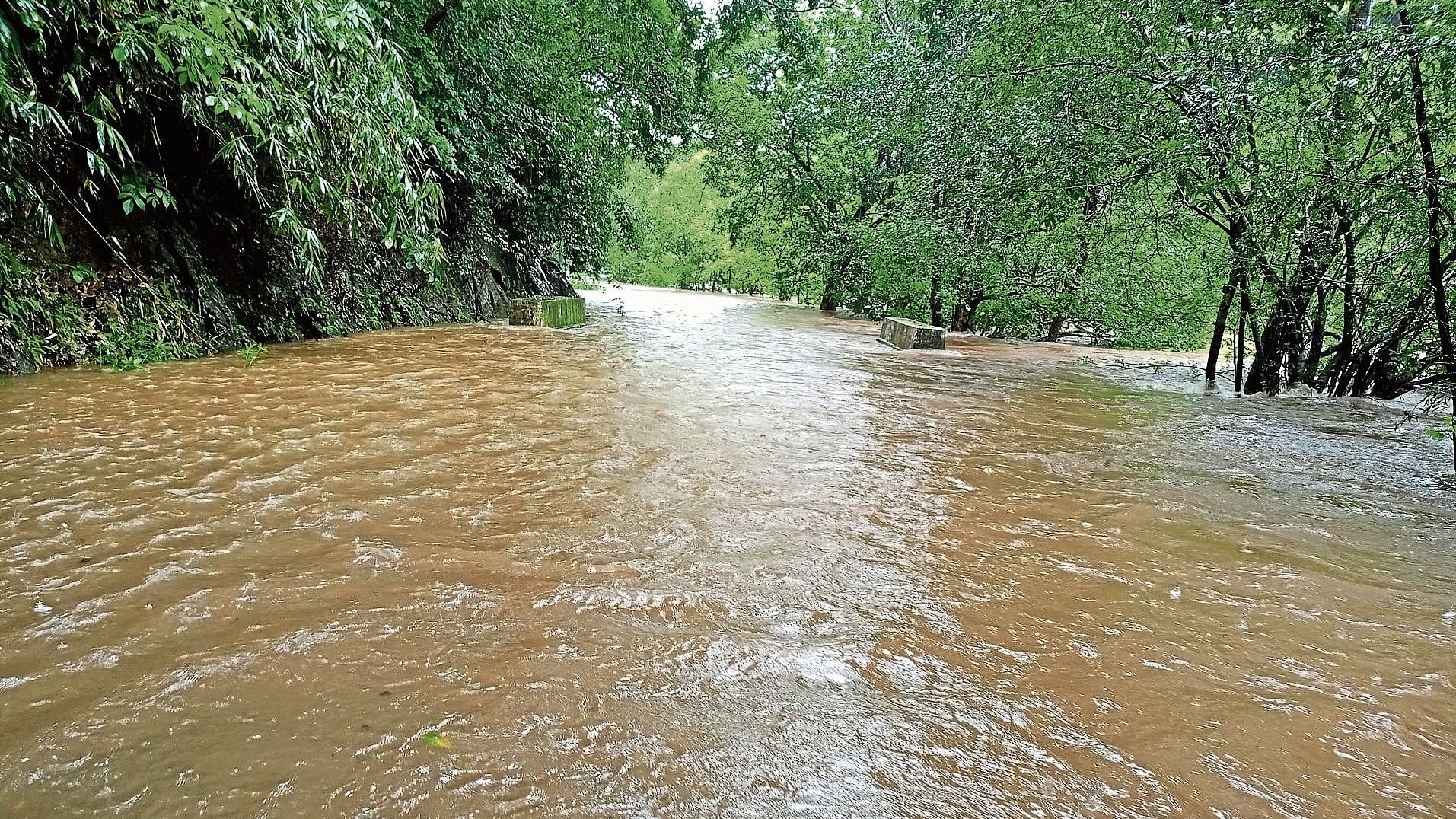 The state highway connecting Anashi and Ulavi in Joida taluk of Uttara Kannada district is under water following heavy rains. 