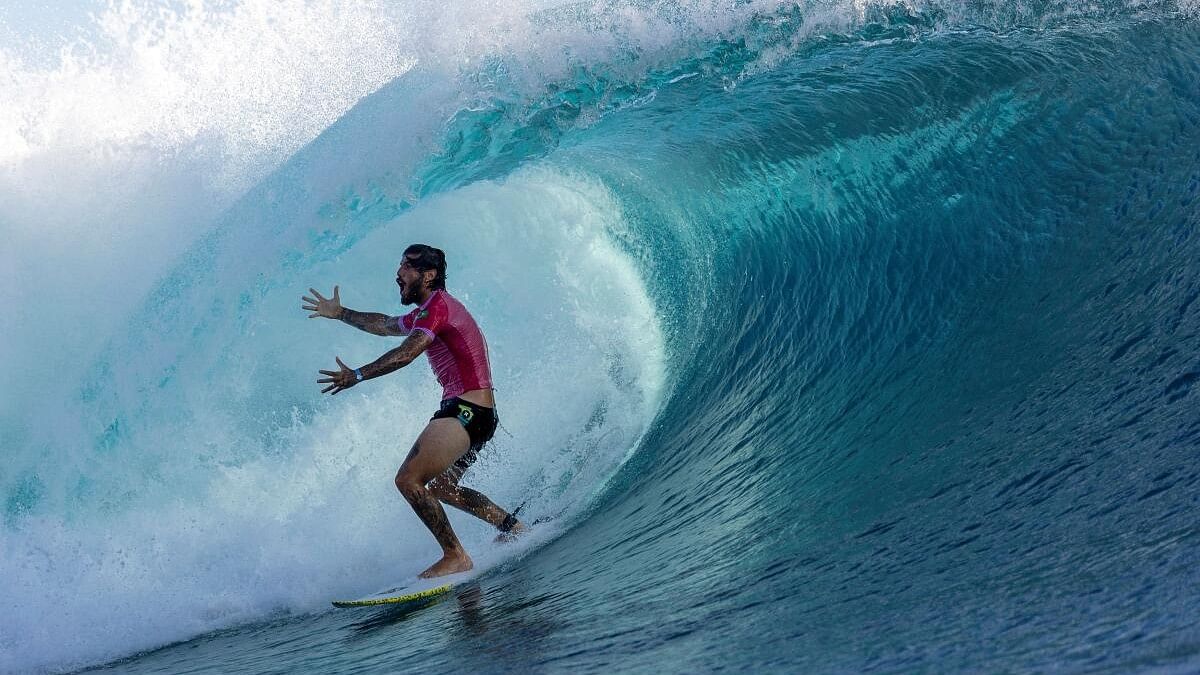 <div class="paragraphs"><p> Filipe Toledo of Brazil reacts as he exits a wave</p></div>