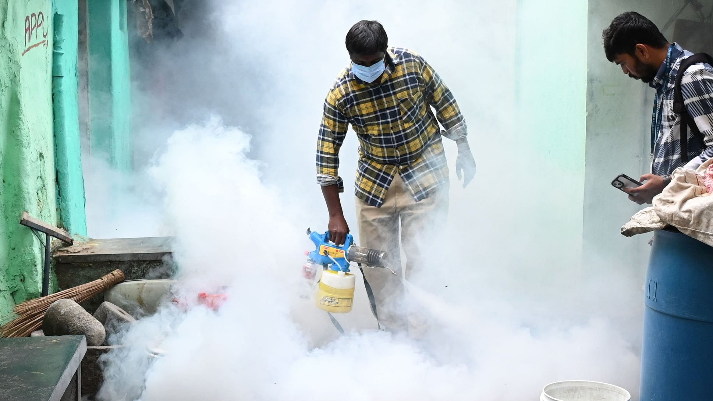 <div class="paragraphs"><p>A health department worker fogging in a bid to kill mosquitoes awake of dengue and other diseases at Arasappa compound near Sampangiramnagar in Bengaluru on Saturday. </p></div>