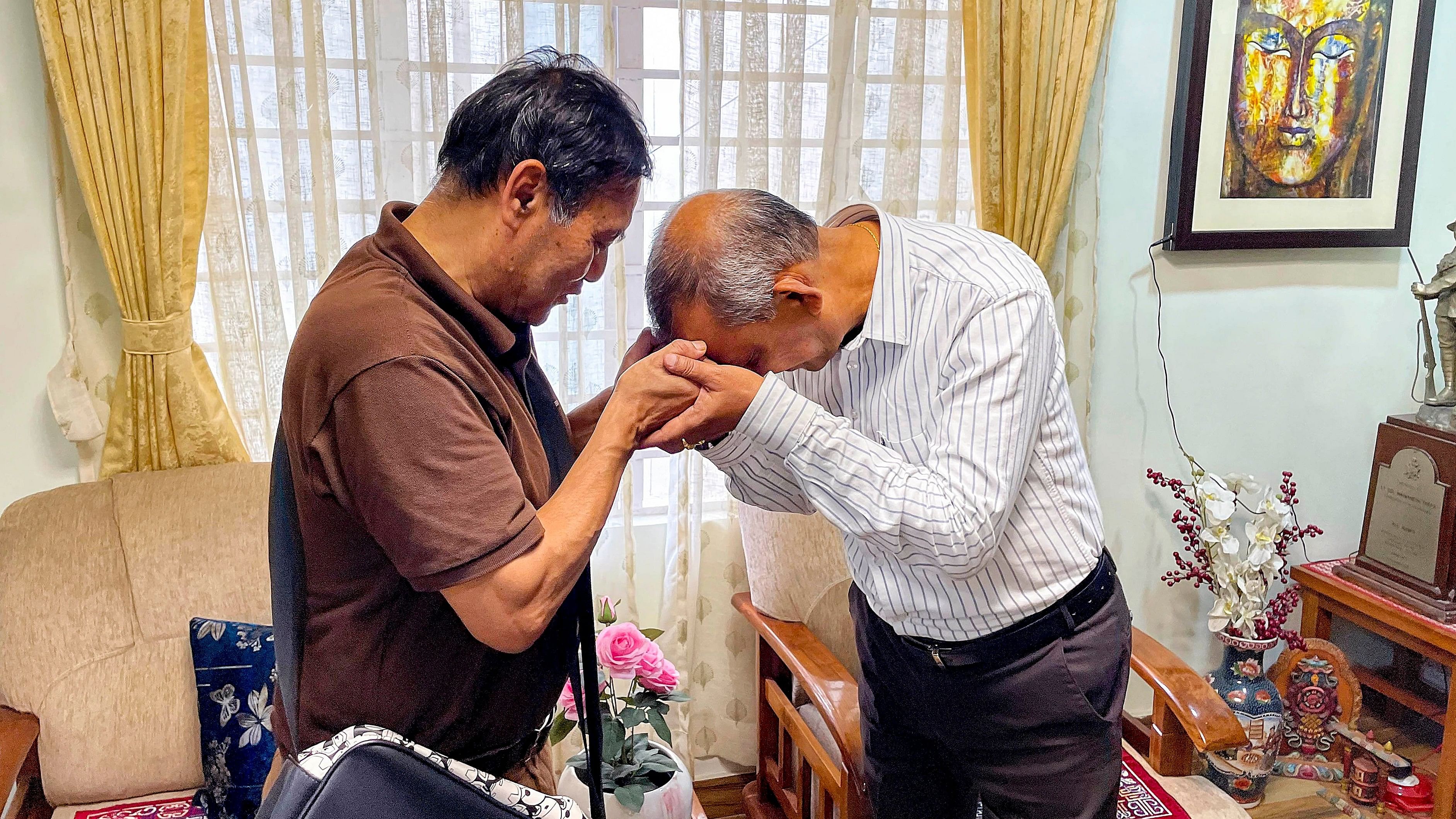 <div class="paragraphs"><p> Siliguri Mayor Goutam Deb meets father of Army captain Brijesh Thapa who was killed in a terrorist encounter in Jammu and Kashmir's Doda district, at his house in Darjeeling district, Tuesday, July 16, 2024. </p></div>