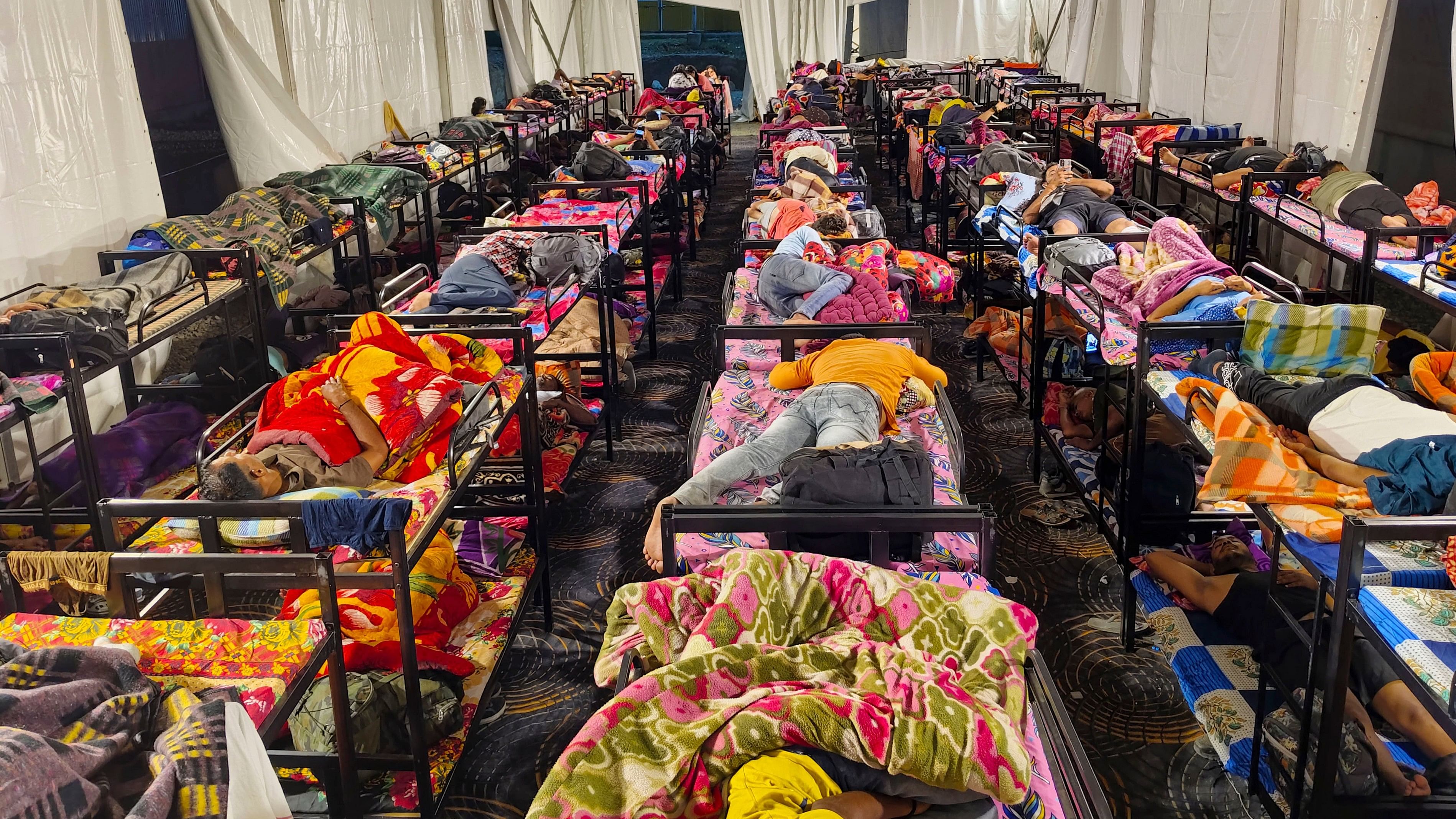 <div class="paragraphs"><p>Pilgrims sleep at a CRPF camp before undertaking the Amarnath Yatra, in Banihal of Ramban district.</p></div>