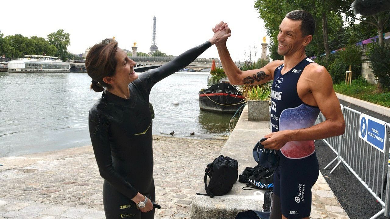 <div class="paragraphs"><p>French&nbsp;Sports&nbsp;Minister&nbsp;Amelie Oudea Castera poses for a photo with French Paralympic triathlon champion Alexis Hanquinquant after taking a plunge in River&nbsp;Seine.</p></div>