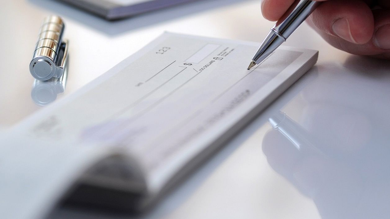 <div class="paragraphs"><p>Businessman writing a cheque. Representative image.</p></div>