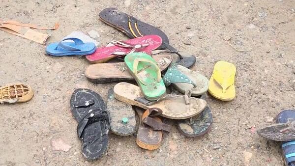 <div class="paragraphs"><p>Footwear lying at the scene a day after a massive stampede that took during a 'satsang' (religious congregation), in Sikandara Rao area in Hathras district.</p></div>