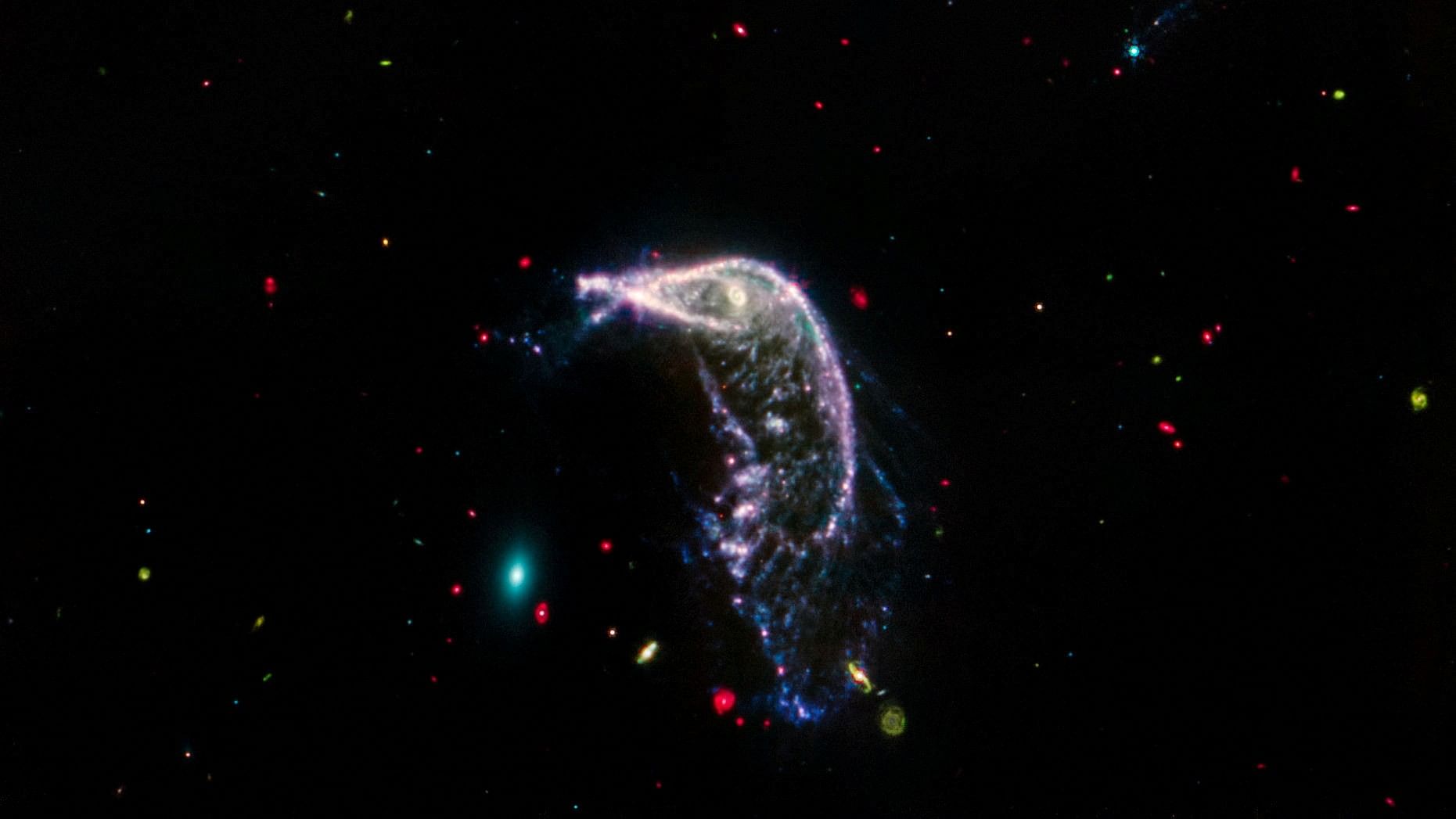 <div class="paragraphs"><p>Arp 142, two interacting galaxies, are shown in an image obtained by the James Webb Space Telescope.</p></div>