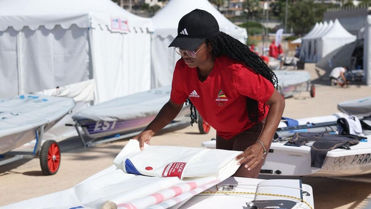 <div class="paragraphs"><p>Deizy Nhaquile of Mozambique prepares a sail before training.</p></div>