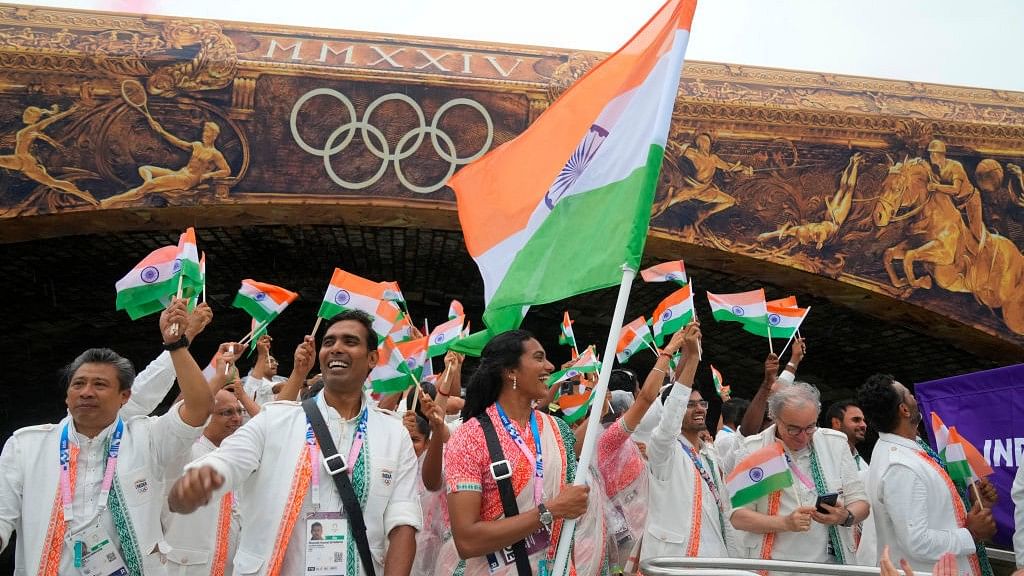 <div class="paragraphs"><p>Athletes of India aboard a boat in the floating parade on the river Seine during the opening ceremony.</p></div>