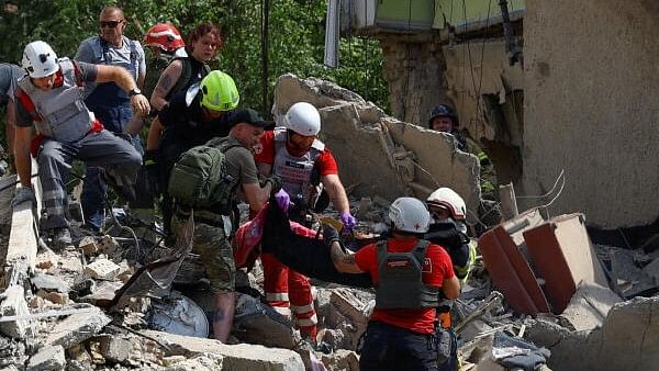 <div class="paragraphs"><p>Rescuers and paramedics carry a body of a child found at a site heavily damaged during a Russian missile strike, amid Russia's attack on Ukraine, in Kyiv, Ukraine July 8, 2024.</p></div>