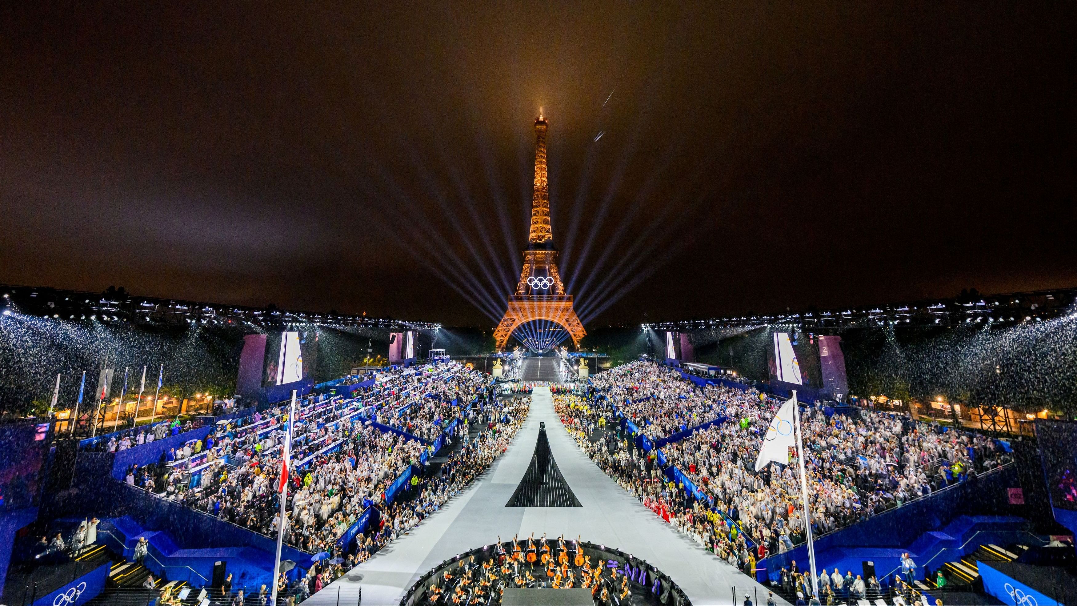 <div class="paragraphs"><p>Overview of the Trocadero venue, with the Eiffel Tower looming in the background while the Olympic flag is being raised, during the opening ceremony of the Paris 2024 Olympic Games.</p></div>