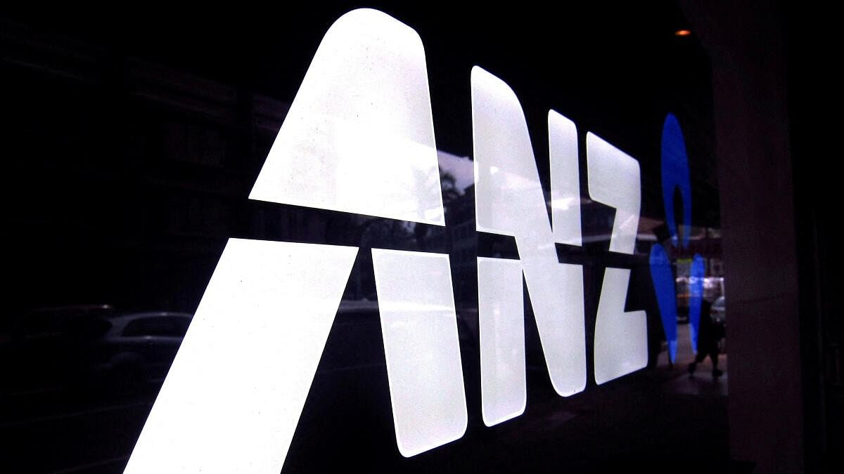 <div class="paragraphs"><p>A man walks past a branch of the Australia and New Zealand Banking Group Ltd (ANZ).</p></div>