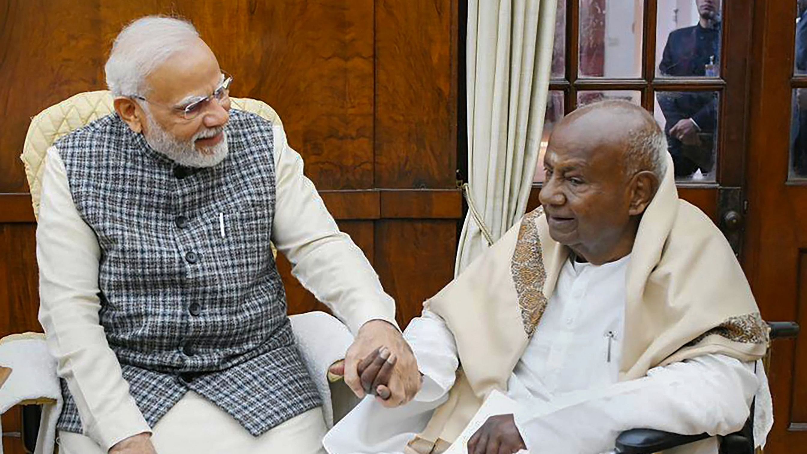 <div class="paragraphs"><p>Prime Minister Narendra Modi with former prime minister HD Deve Gowda during a meeting, at Parliament in New Delhi, Tuesday.</p></div>