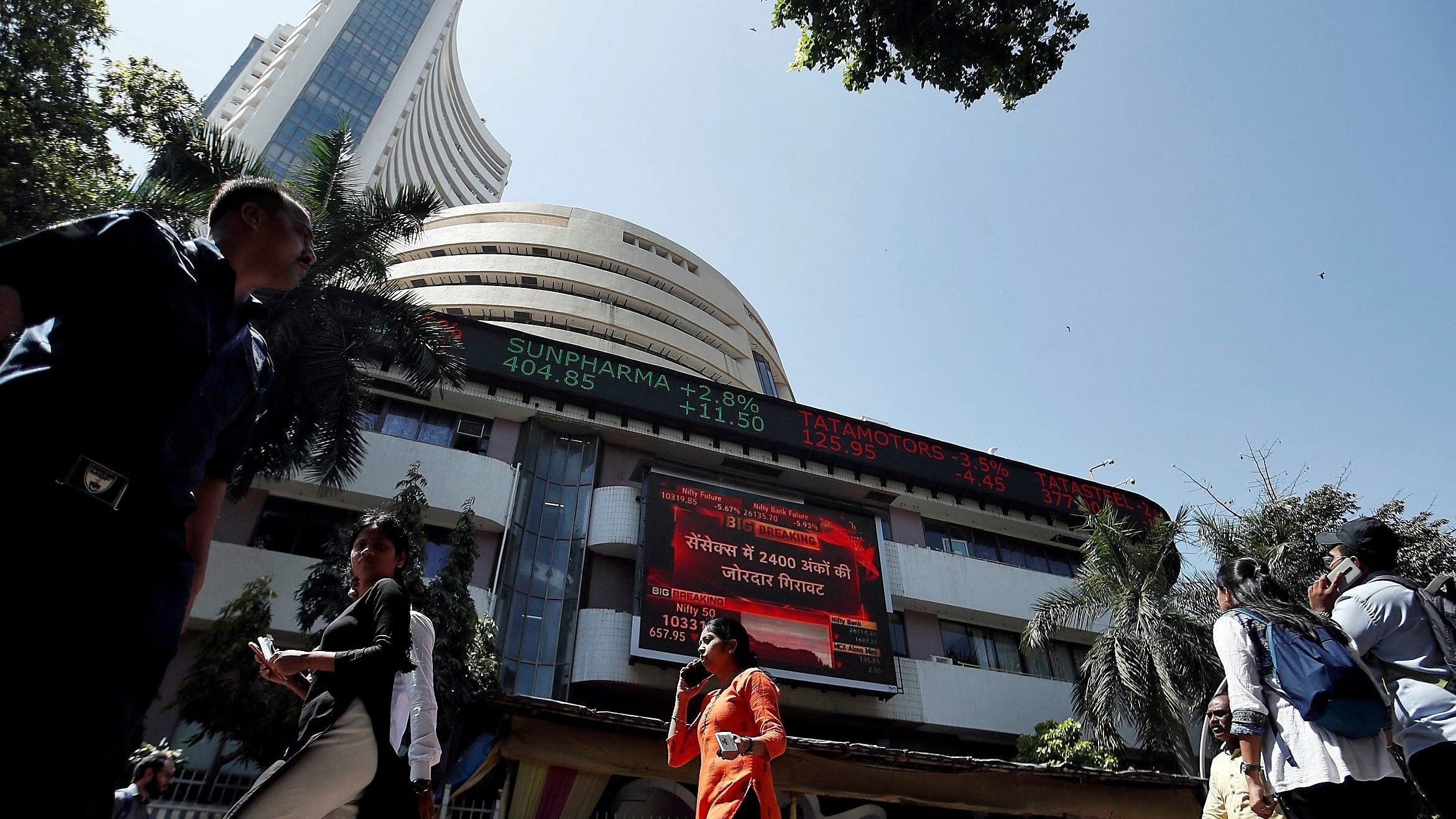 <div class="paragraphs"><p>People walk past the Bombay Stock Exchange  building in Mumbai.</p></div>