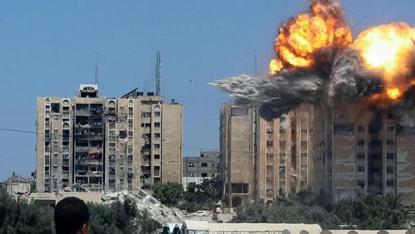 <div class="paragraphs"><p>An explosion occurs following an Israeli air strike on a residential building, amid the Israel-Hamas conflict, in Nuseirat in the central Gaza Strip, July 20.</p></div>