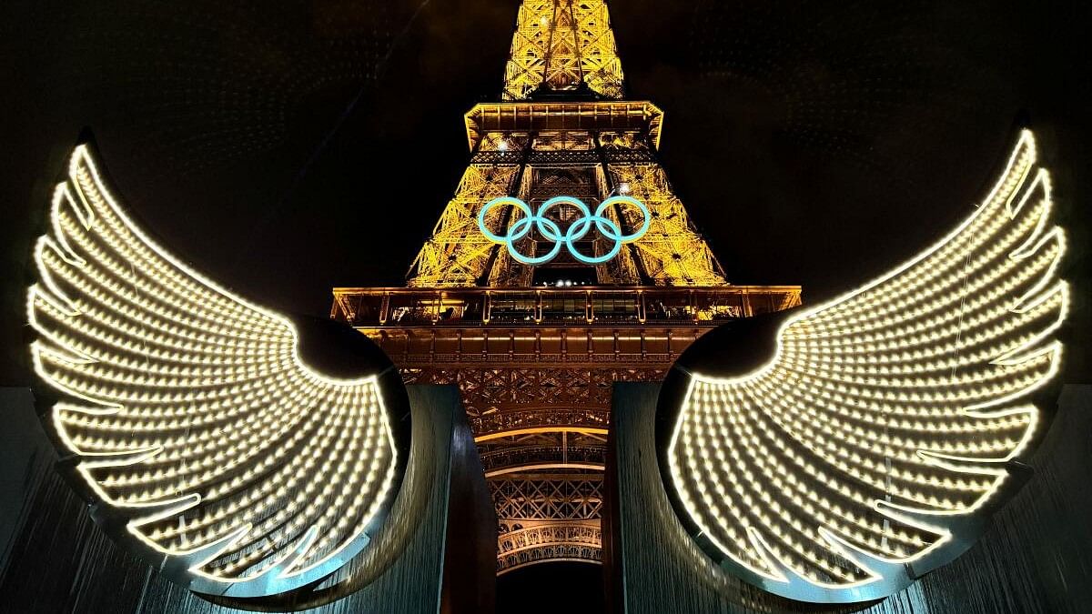 <div class="paragraphs"><p>A general view showing wings and the Olympic rings on the Eiffel Tower.</p></div>