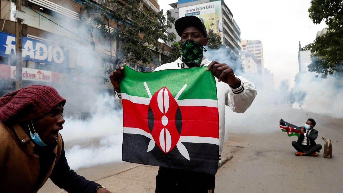 <div class="paragraphs"><p>Protesters hold flags as they participate in an anti-government demonstration, following nationwide deadly riots over tax hikes and a controversial now-withdrawn finance bill, in Nairobi, Kenya.</p></div>