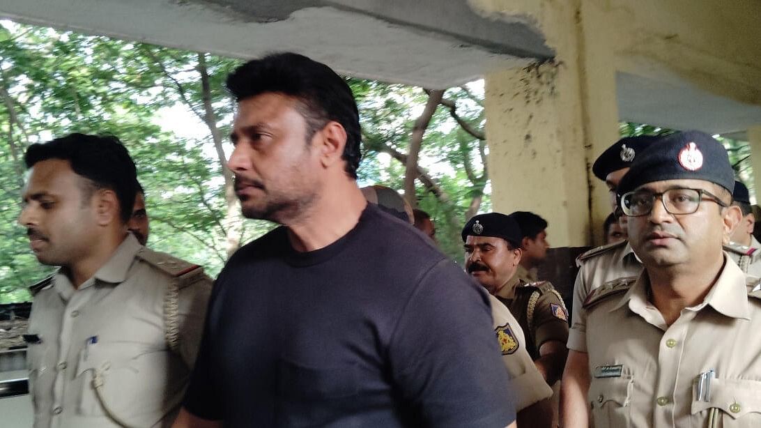 <div class="paragraphs"><p>Actor Darshan Thoogudeepa being escorted by the police.</p></div>