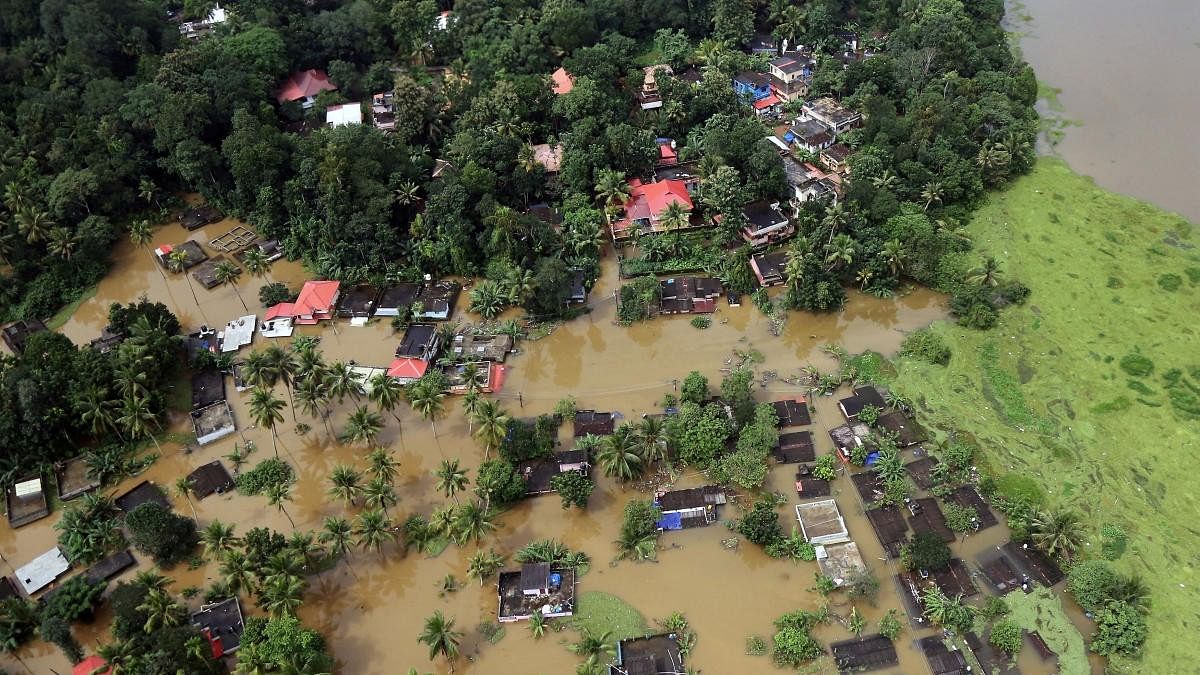 <div class="paragraphs"><p>An aerial view shows partially submerged houses at a flooded area in Kerala. </p></div>