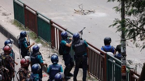 <div class="paragraphs"><p>Members of Border Guard Bangladesh (BGB) and the police work to control the protesters in front of the state-owned Bangladesh Television as violence erupts across the country after anti-quota protests by students, in Dhaka.</p></div>