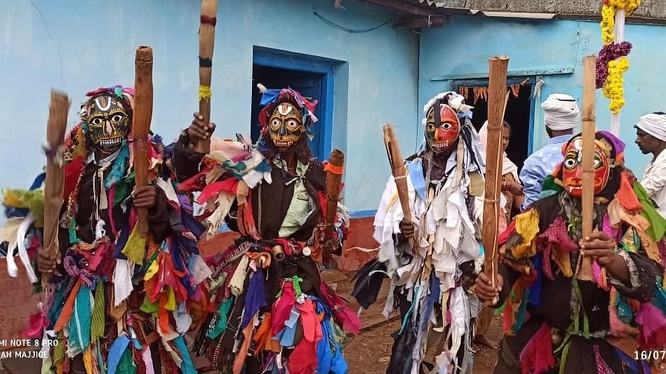 People participate in Muharram rituals at the mosque at Kurubnal village in Koppal district. 