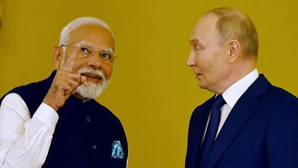 <div class="paragraphs"><p>Russia's President Vladimir Putin talks to India's Prime Minister Narendra Modi before awarding him the Order of St. Andrew the Apostle the First-Called at the Kremlin in Moscow, Russia.&nbsp;</p></div>