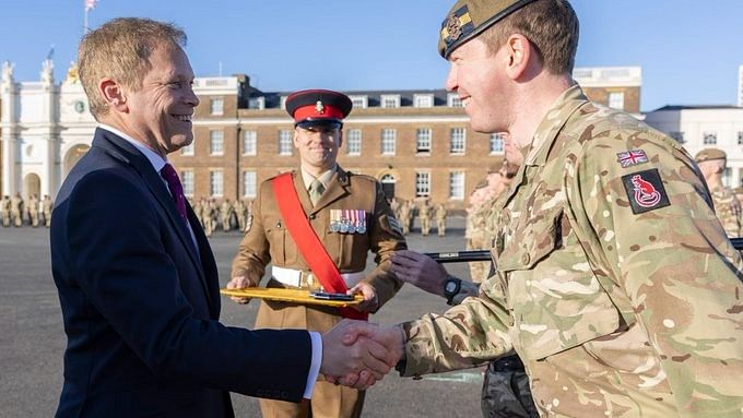 <div class="paragraphs"><p>British defence minister Grant Shapps is seen meeting a member of the Armed Forces.</p></div>