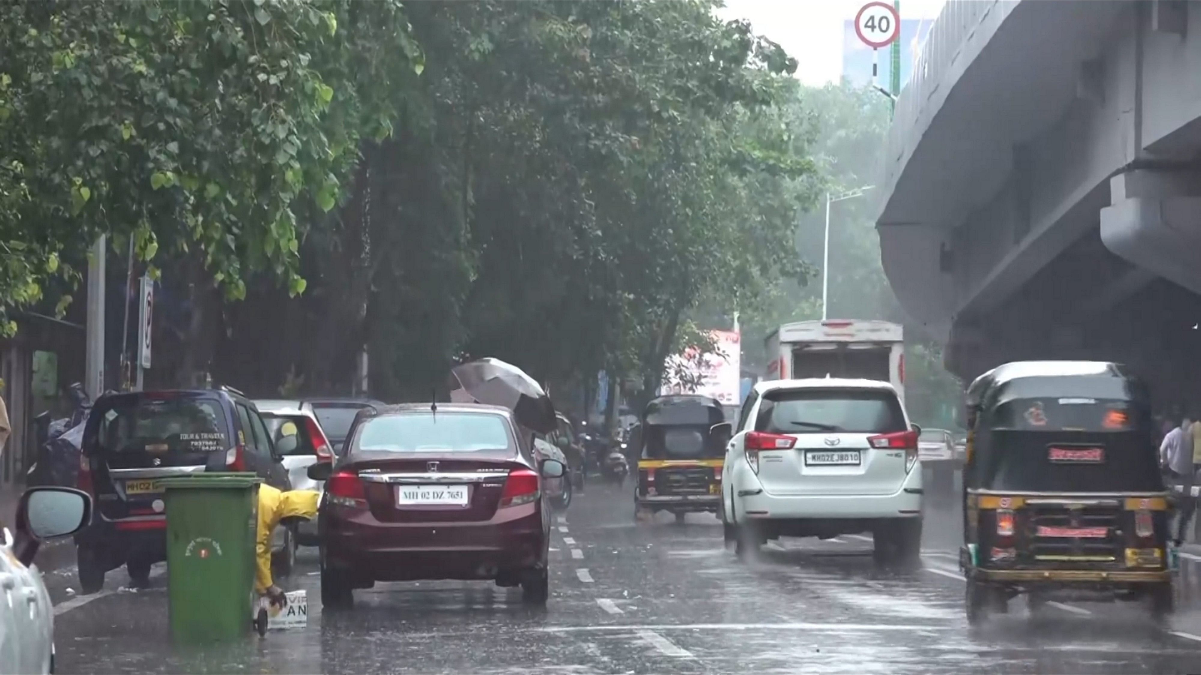 <div class="paragraphs"><p>Commuters amid rains near Mumbai Airport, Saturday, July 13, 2024.   </p></div>