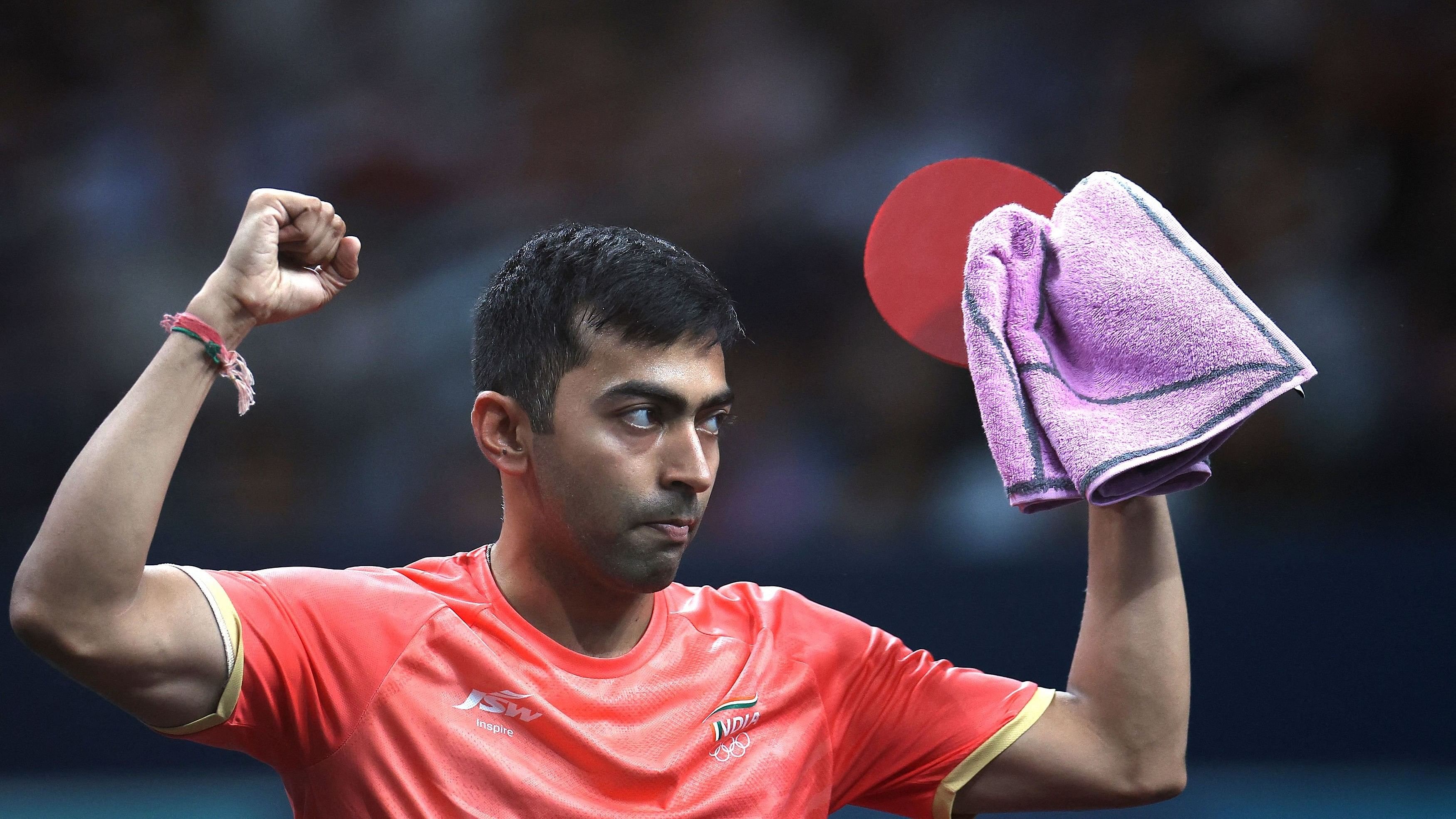 <div class="paragraphs"><p>Harmeet Desai of India celebrates after winning his preliminary round match against Zaid Abu Yaman of Jordan. </p></div>