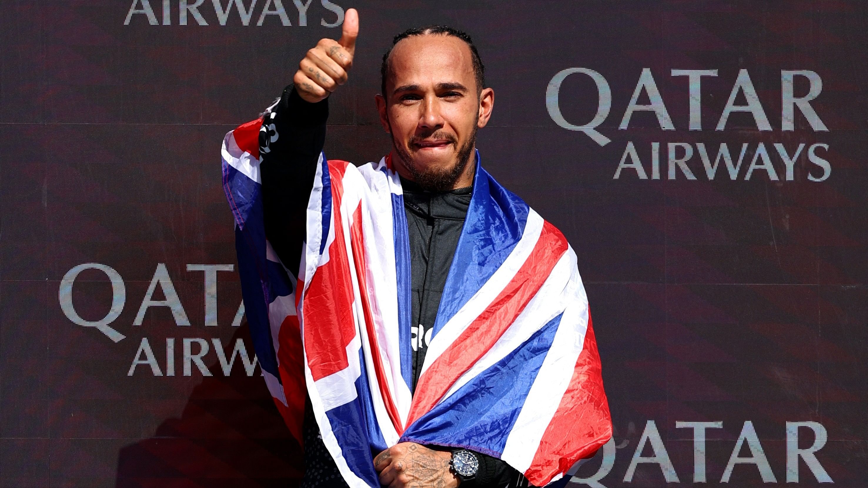 <div class="paragraphs"><p>Mercedes' Lewis Hamilton celebrates on the podium after winning the British Grand Prix</p></div>