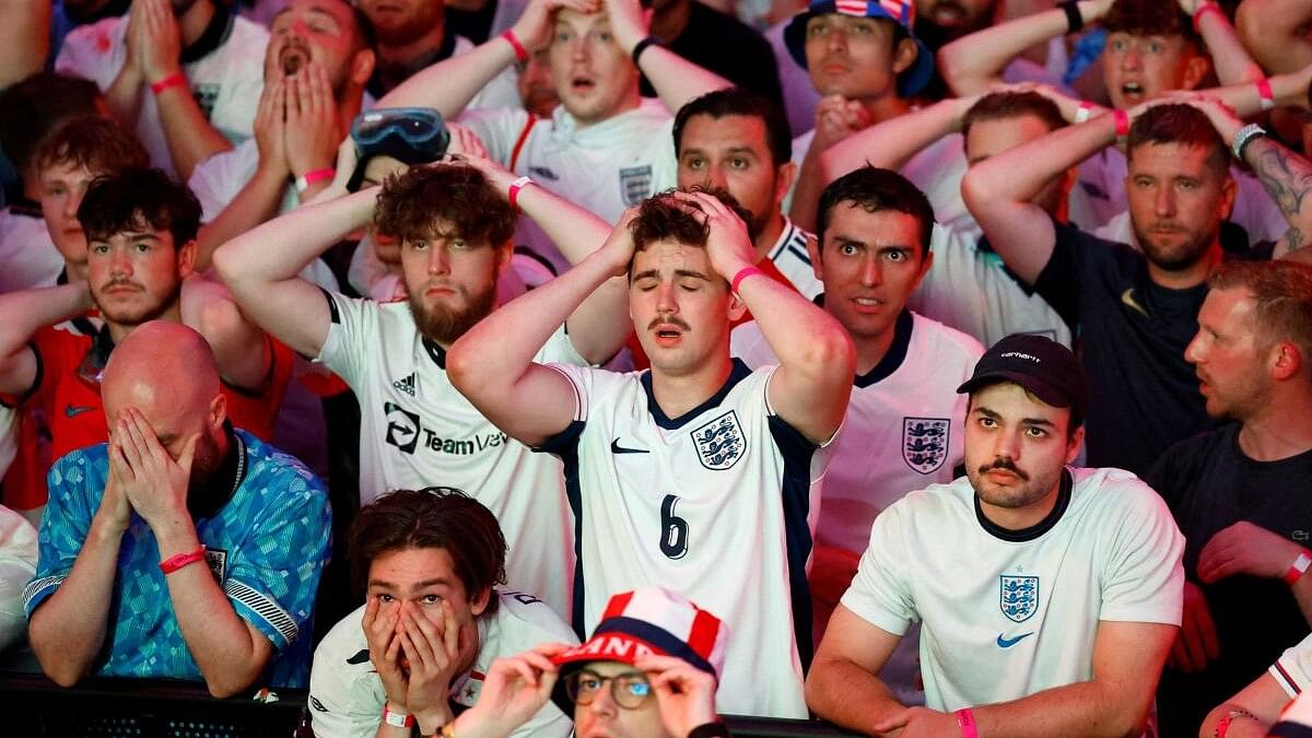 <div class="paragraphs"><p>England fans react after Spain's Mikel Oyarzabal scores their second goal.</p></div>