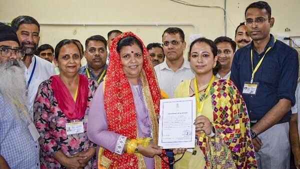 <div class="paragraphs"><p>Congress candidate Kamlesh Thakur receives the 'certificate of election' after her victory from Dehra seat in Himachal Pradesh by-elections in Kangra district on&nbsp; July 13, 2024. </p></div>