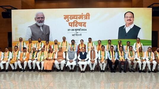 <div class="paragraphs"><p>Prime Minister Narendra Modi with Defence Minister Rajnath Singh, Union Home Minister Amit Shah, Union Minister and BJP National President J P Nadda and others during a meeting with Chief Ministers of the NDA-ruled states, at BJP headquarters, in New Delhi, Sunday.</p></div>