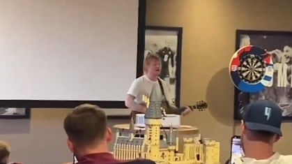 <div class="paragraphs"><p>Ed Sheeran performing for the English football team.</p></div>